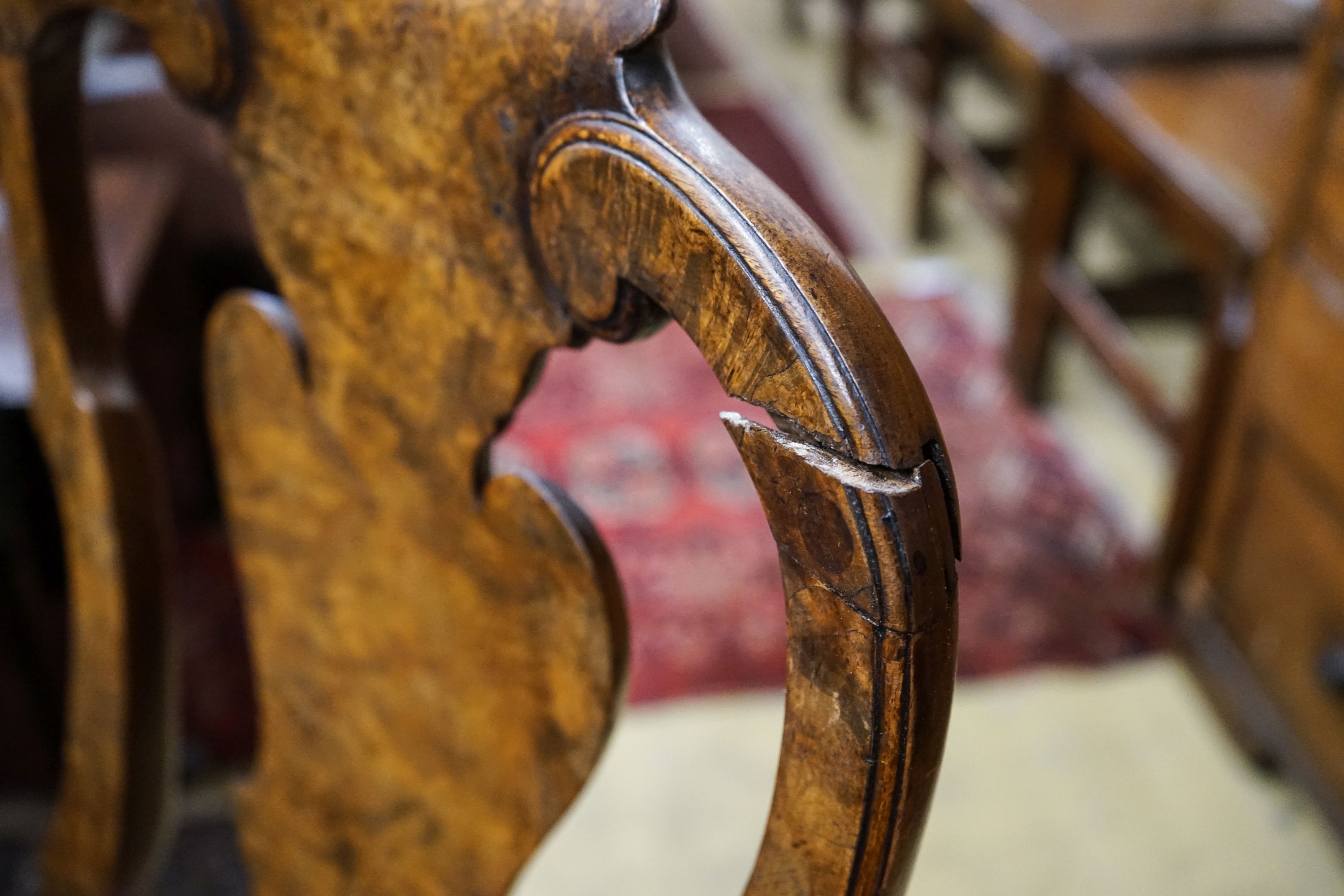 A set of four Queen Anne revival walnut dining chairs